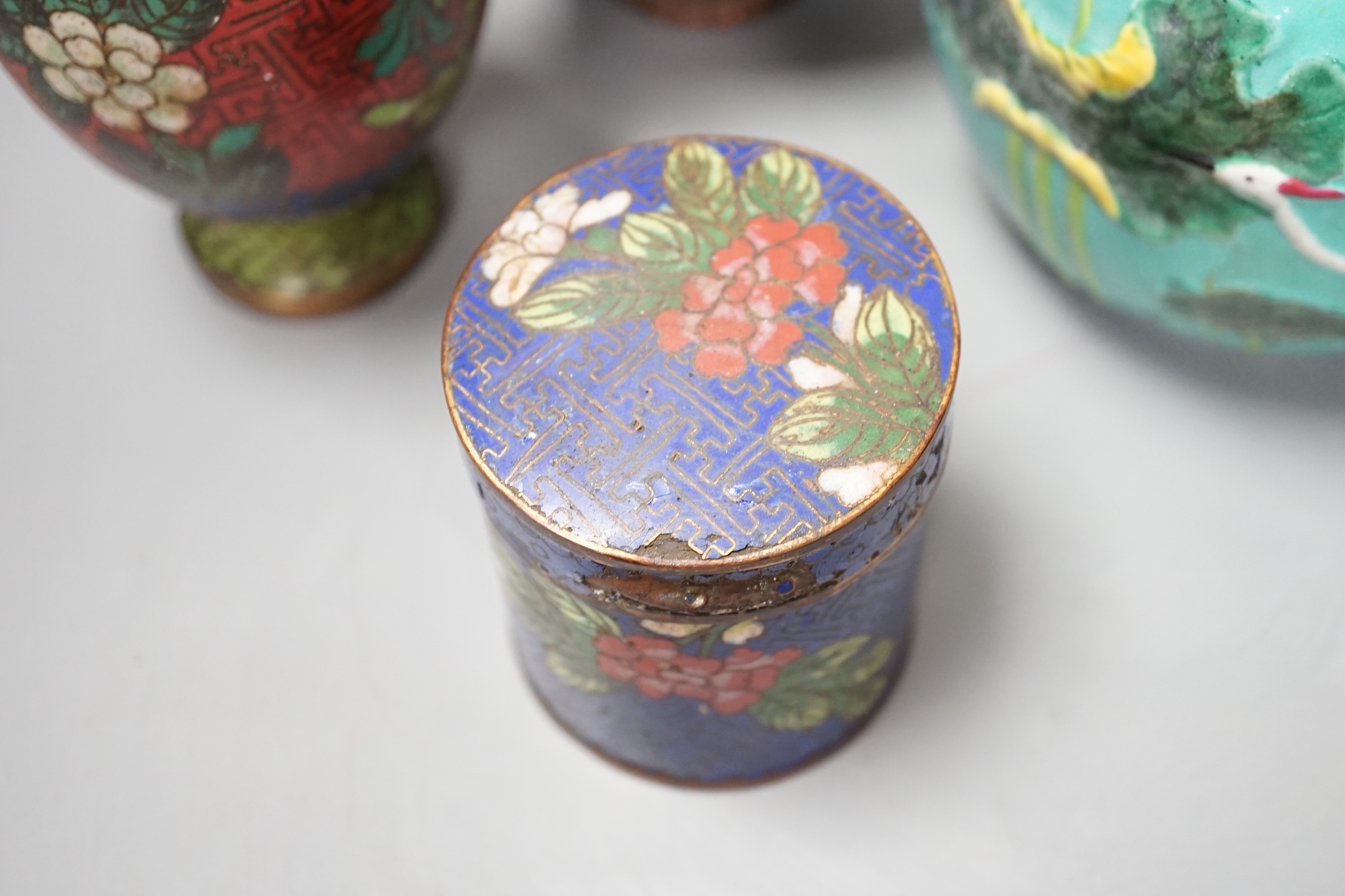 A group of Chinese porcelain vases, a cloisonné enamel vase and pot and a Middle Eastern metal vase, tallest 23 cm